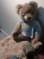 medium-close shot of teddy bear and jewellery box, taken from slightly above, with bear looking towards camera